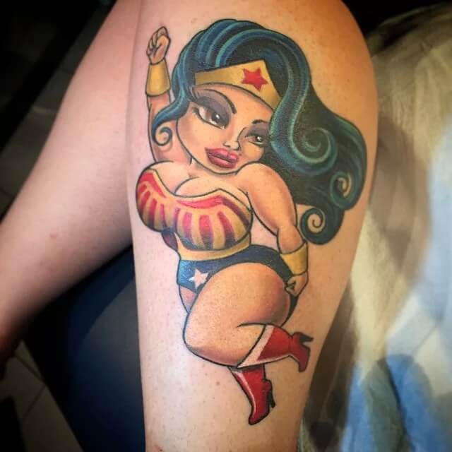 32: Chubby pin up style tattoo of the hero.